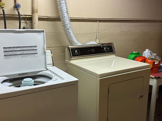 washroom featuring independent washer and dryer