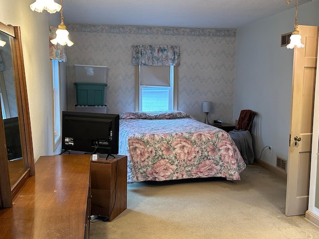 1213 Minnesota Ave, Detroit Lakes, MN 56501 - bedroom featuring carpet and wallpapered walls