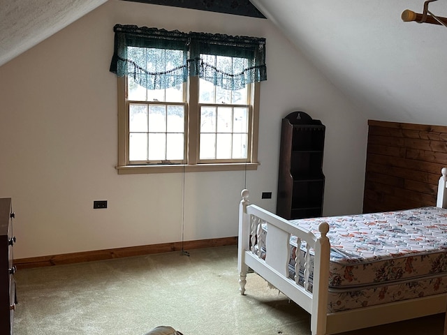 1213 Minnesota Ave, Detroit Lakes, MN 56501 - carpeted bedroom with lofted ceiling and baseboards