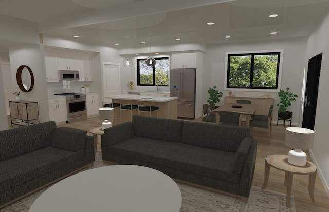 living area with light wood-style flooring, baseboards, and recessed lighting