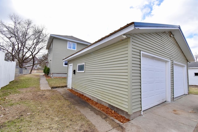 view of home's exterior featuring fence and an outdoor structure
