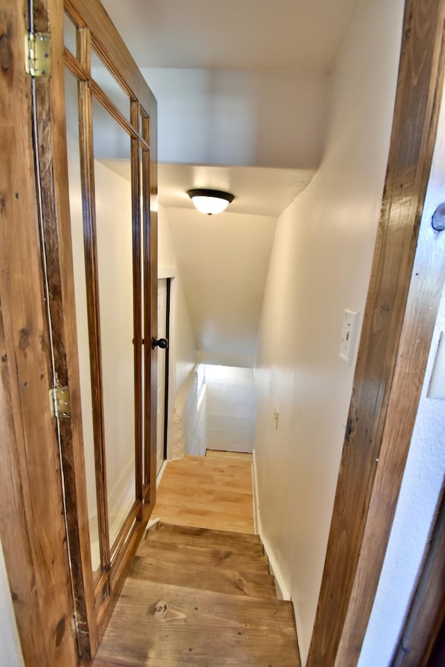 corridor featuring wood finished floors