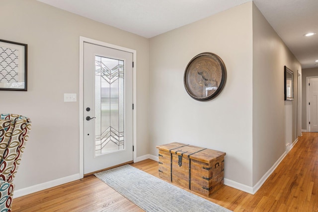 entryway featuring light wood-style floors, baseboards, and recessed lighting