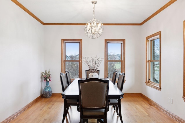 dining area featuring a chandelier, light wood-type flooring, and plenty of natural light