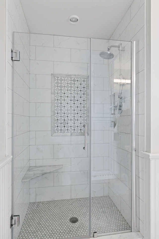 bathroom with a shower stall
