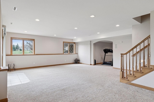 interior space with recessed lighting, visible vents, arched walkways, carpet floors, and stairs