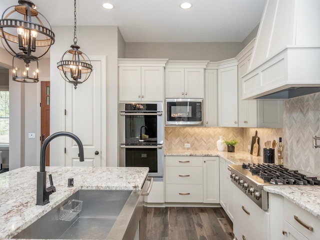 2728 Chowen Ave S, Minneapolis, MN 55416 - kitchen with an inviting chandelier, dark wood-style flooring, custom range hood, a sink, and stainless steel appliances