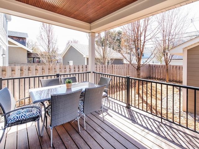 2728 Chowen Ave S, Minneapolis, MN 55416 - wooden deck with outdoor dining area and a fenced backyard