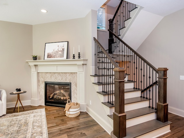 2728 Chowen Ave S, Minneapolis, MN 55416 - stairway with a tiled fireplace, baseboards, recessed lighting, and wood finished floors