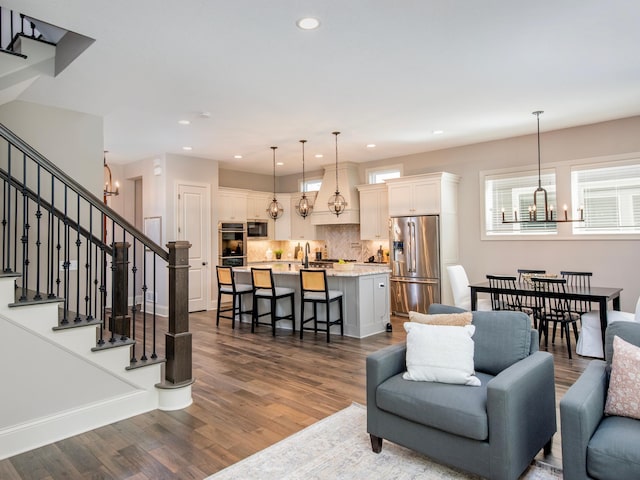 2728 Chowen Ave S, Minneapolis, MN 55416 - living area with baseboards, stairway, dark wood-type flooring, recessed lighting, and a notable chandelier