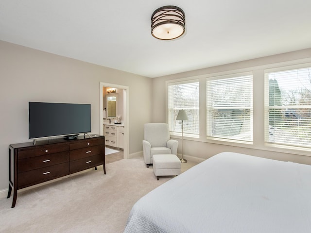 2728 Chowen Ave S, Minneapolis, MN 55416 - bedroom featuring baseboards, ensuite bath, and light colored carpet