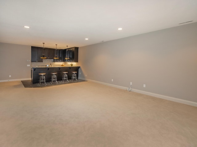 2728 Chowen Ave S, Minneapolis, MN 55416 - unfurnished living room with indoor wet bar, recessed lighting, baseboards, and light colored carpet