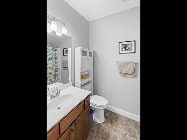 1128 Willowbrook Cir, Delano, MN 55328 - bathroom with toilet, vanity, baseboards, and a shower with shower curtain
