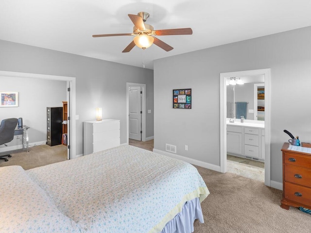 1128 Willowbrook Cir, Delano, MN 55328 - bedroom featuring light carpet, baseboards, an office area, and a sink
