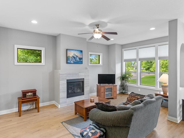 1128 Willowbrook Cir, Delano, MN 55328 - living room featuring light wood-style flooring, a ceiling fan, plenty of natural light, and recessed lighting
