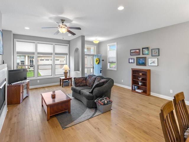 1128 Willowbrook Cir, Delano, MN 55328 - living area with baseboards, ceiling fan, light wood-style flooring, recessed lighting, and a fireplace