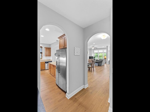 1128 Willowbrook Cir, Delano, MN 55328 - corridor featuring arched walkways, light wood-type flooring, baseboards, and recessed lighting