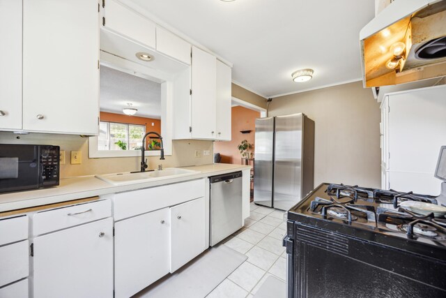 kitchen with black appliances, a sink, light countertops, white cabinets, and ornamental molding