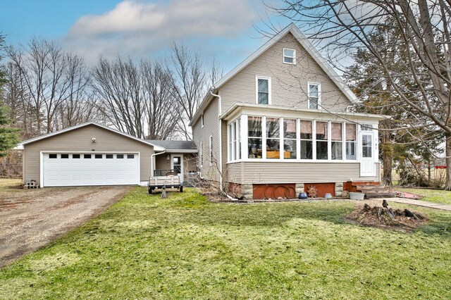 29058 132nd St, Waseca, MN 56093 - view of front facade featuring driveway, a front yard, and a sunroom