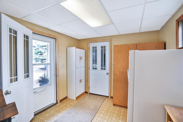 29058 132nd St, Waseca, MN 56093 - kitchen with freestanding refrigerator, a paneled ceiling, and light flooring