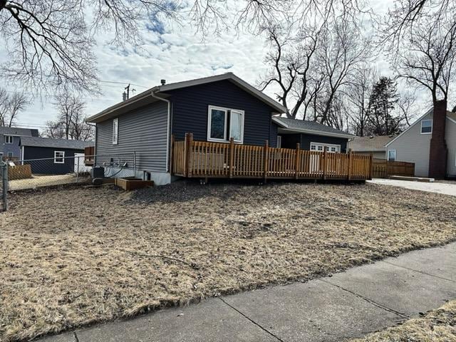 exterior space with a deck and fence