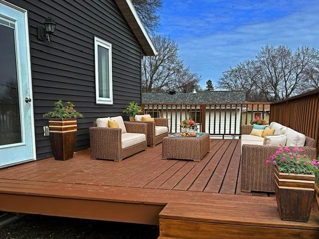 wooden terrace featuring outdoor lounge area