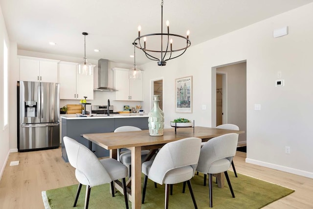 11525 202nd St W, Lakeville, MN 55044 - dining space featuring an inviting chandelier, light wood-style flooring, recessed lighting, and baseboards