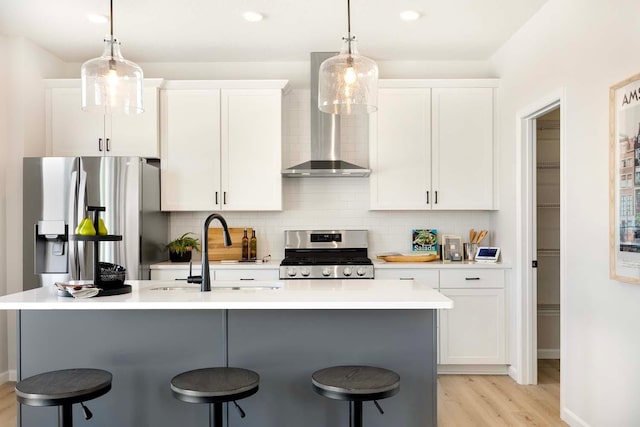 11525 202nd St W, Lakeville, MN 55044 - kitchen featuring a sink, a kitchen breakfast bar, wall chimney exhaust hood, and stainless steel appliances