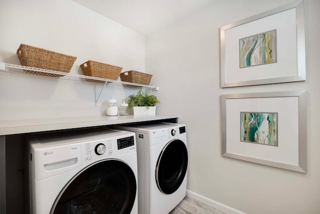 11525 202nd St W, Lakeville, MN 55044 - laundry room with laundry area, washing machine and dryer, and baseboards