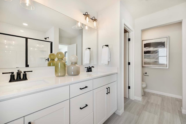 11525 202nd St W, Lakeville, MN 55044 - full bath featuring a sink, toilet, a stall shower, and double vanity