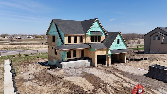 unfinished property with roof with shingles