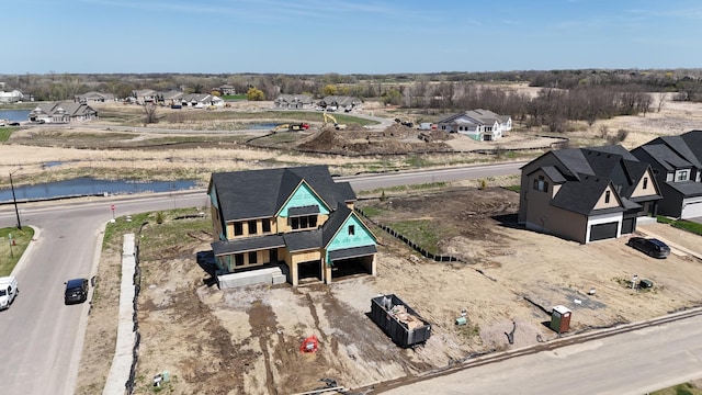 bird's eye view featuring a residential view and a water view