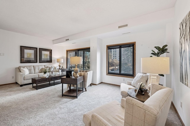 1235 Yale Pl Unit 207, Minneapolis, MN 55403 - carpeted living room with baseboards and visible vents