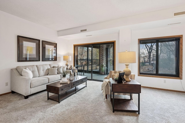 1235 Yale Pl Unit 207, Minneapolis, MN 55403 - carpeted living area featuring baseboards and visible vents