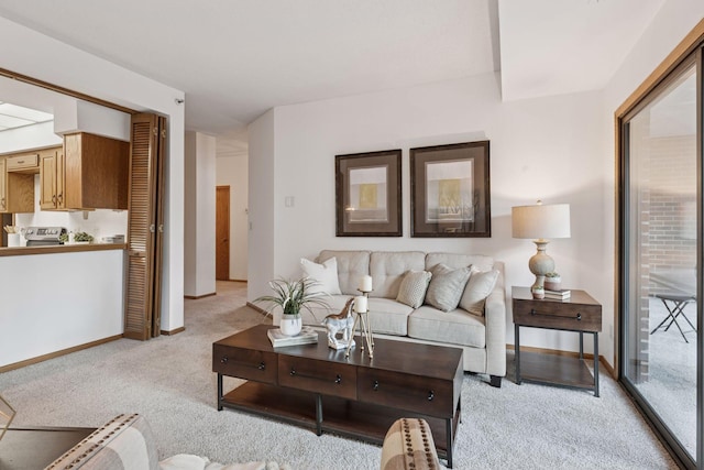 1235 Yale Pl Unit 207, Minneapolis, MN 55403 - living area featuring baseboards and light carpet