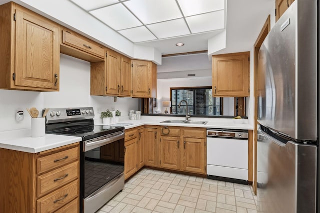 1235 Yale Pl Unit 207, Minneapolis, MN 55403 - kitchen with a sink, appliances with stainless steel finishes, brick patterned floor, and light countertops