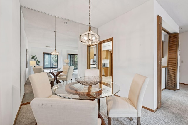 1235 Yale Pl Unit 207, Minneapolis, MN 55403 - dining area featuring baseboards, light colored carpet, and an inviting chandelier