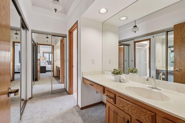 1235 Yale Pl Unit 207, Minneapolis, MN 55403 - bathroom featuring carpet floors, vanity, ensuite bathroom, baseboards, and walk in shower