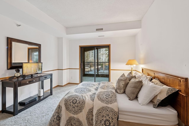 1235 Yale Pl Unit 207, Minneapolis, MN 55403 - carpeted bedroom featuring access to outside, baseboards, and visible vents