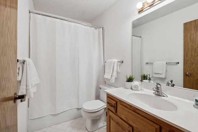 1235 Yale Pl Unit 207, Minneapolis, MN 55403 - bathroom with vanity, tile patterned floors, shower / bath combo, and toilet