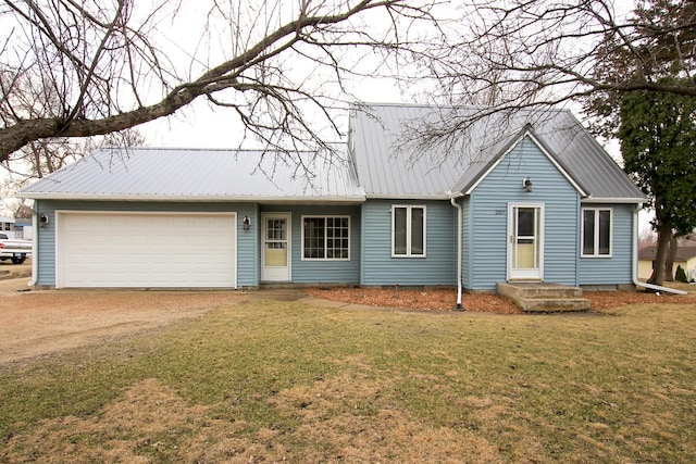 207 Astro Blvd W, Cosmos, MN 56228 - ranch-style house featuring a front yard, driveway, a garage, and metal roof