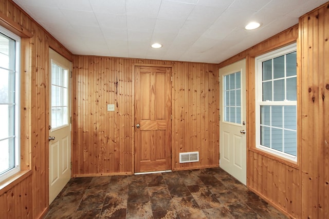 207 Astro Blvd W, Cosmos, MN 56228 - doorway to outside with stone finish floor, visible vents, wooden walls, and recessed lighting