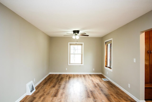 207 Astro Blvd W, Cosmos, MN 56228 - spare room with baseboards, ceiling fan, and visible vents