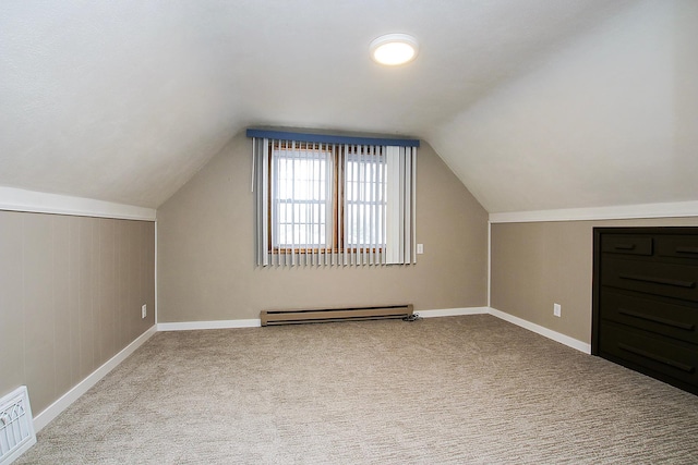 207 Astro Blvd W, Cosmos, MN 56228 - additional living space featuring carpet flooring, lofted ceiling, baseboards, visible vents, and a baseboard heating unit