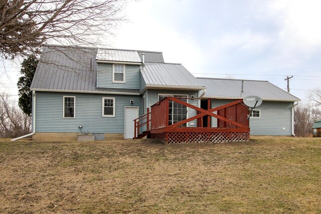 207 Astro Blvd W, Cosmos, MN 56228 - back of house with metal roof, a deck, and a yard