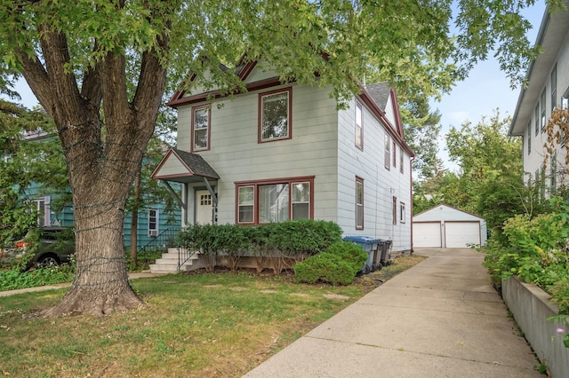 victorian house featuring a detached garage, an outbuilding, a front lawn, and a shingled roof