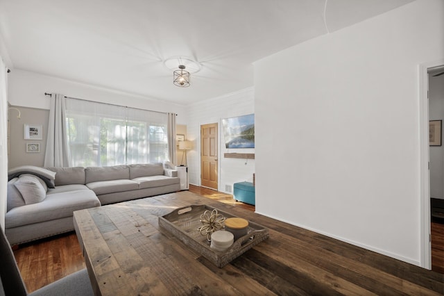 living room featuring baseboards and wood finished floors