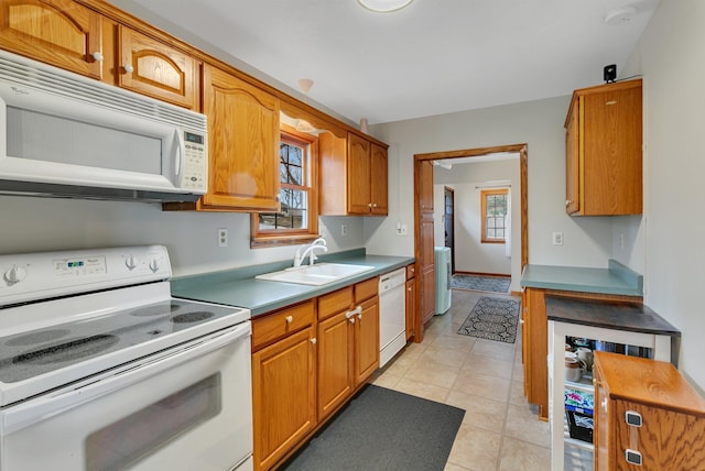 616 Lake Cowdry Rd NW, Alexandria, MN 56308 - kitchen featuring white appliances, brown cabinets, and light tile patterned flooring
