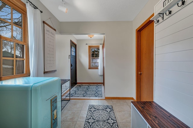 616 Lake Cowdry Rd NW, Alexandria, MN 56308 - entrance foyer featuring light tile patterned flooring and baseboards