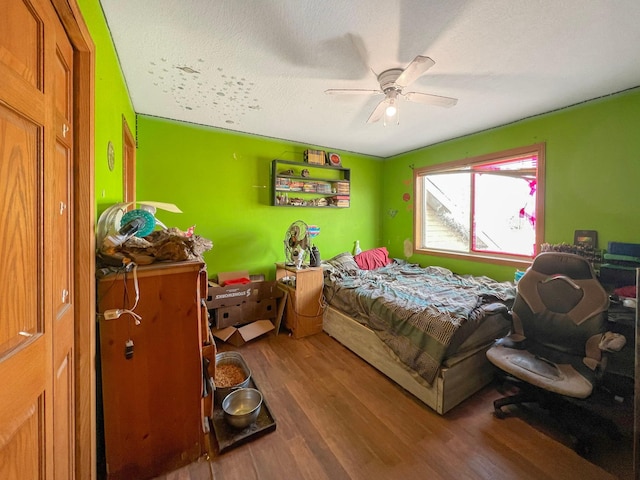 bedroom featuring ceiling fan and wood finished floors